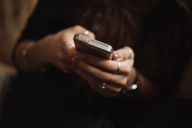 woman using mobile messaging as a form of customer communication